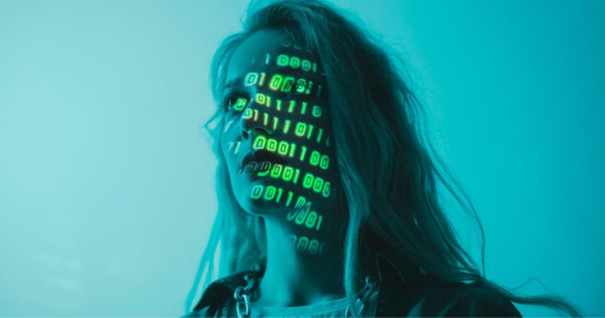 Professional woman with digital binary code projected on her face, representing the AI Filter scanning a LinkedIn profile for machine-readability and authority.